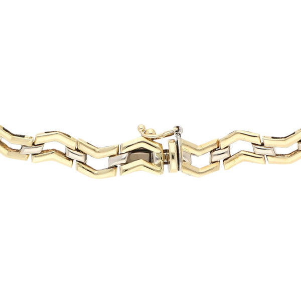 Pulsera eslabón articulado en oro dos tonos 14 kilates.