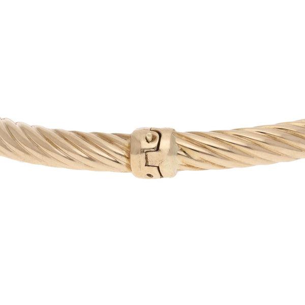 Pulsera de arillo articulada con sintéticos en oro amarillo 14 kilates.