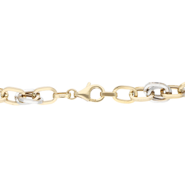 Pulsera eslabón cruzado en oro dos tonos 14 kilates.