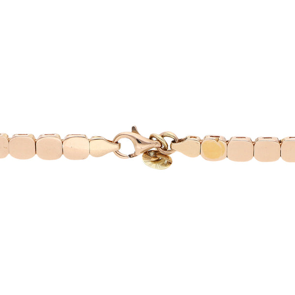 Pulsera eslabón articulado con aplicación y sintéticos en oro dos tonos 14 kilates