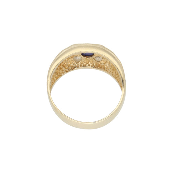 Anillo diseño especial con zafiro estrella y sintéticos en oro amarillo 14 kilates.