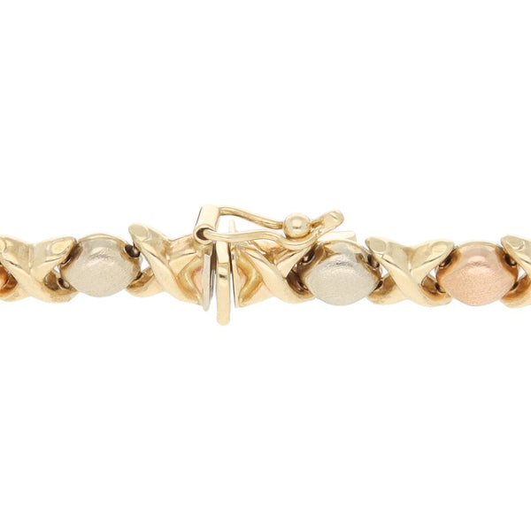 Pulsera eslabón XOXO en oro tres tonos 14 kilates.