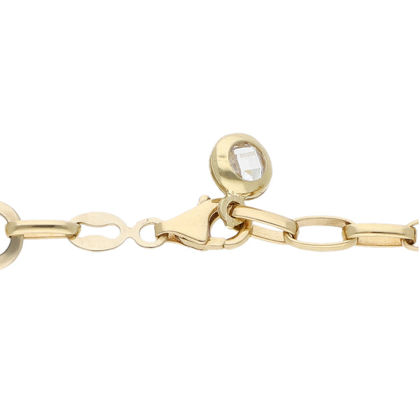 Pulsera eslabón laminado motivo infinito con circonias en oro amarillo 14 kilates.