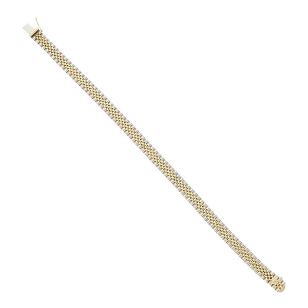 Pulsera eslabón articulado en oro dos tonos 14 kilates.