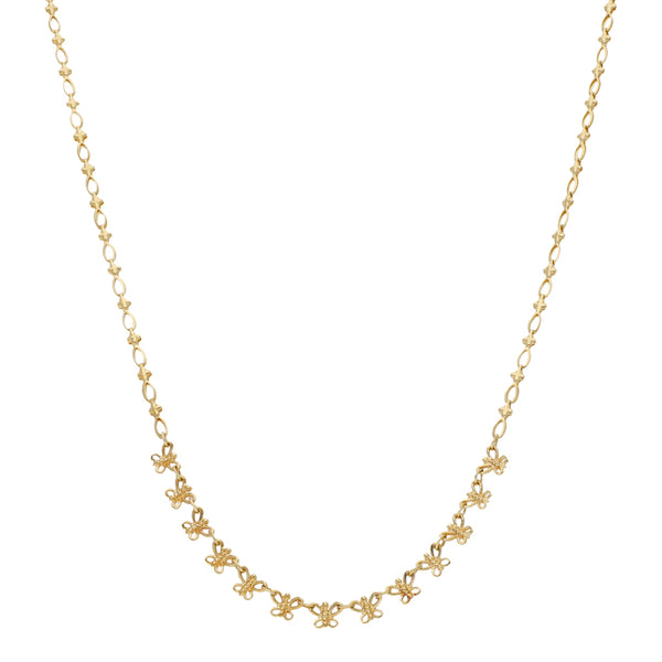 Collar eslabón laminado con aplicaciones motivo mariposa en oro amarillo 14 kilates.