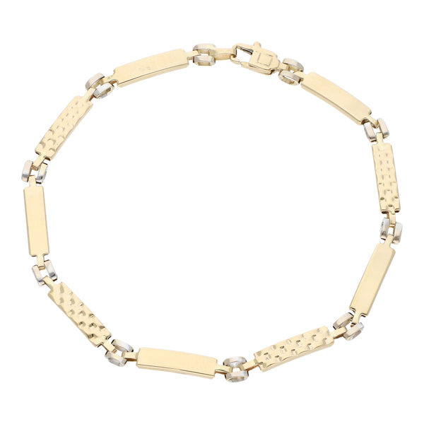 Pulsera eslabón articulado en oro dos tonos 14 kilates.