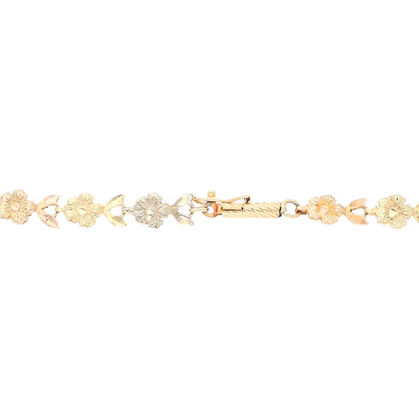 Pulsera eslabón articulado motivo flor en oro tres tonos 14 kilates.