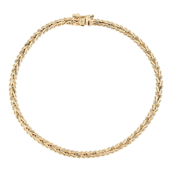 Pulsera eslabón boleado en oro amarillo 14 kilates.