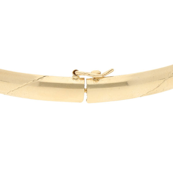 Pulsera de arillo facetada en oro amarillo 14 kilates.