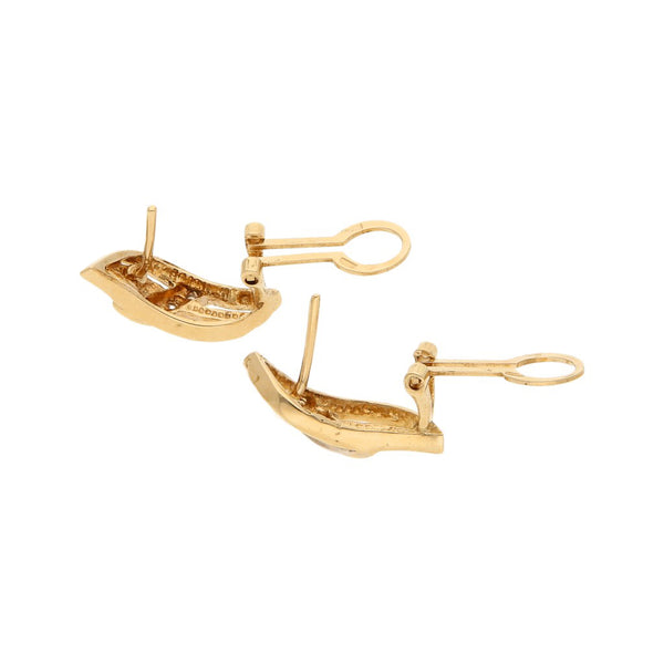 Aretes diseño especial con circonias en oro amarillo 14 kilates.
