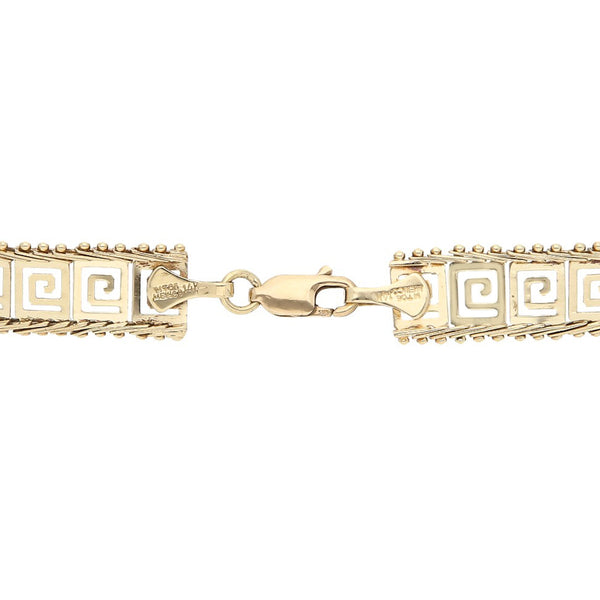 Pulsera eslabón boleado motivo grecas en oro dos tonos 14 kilates.