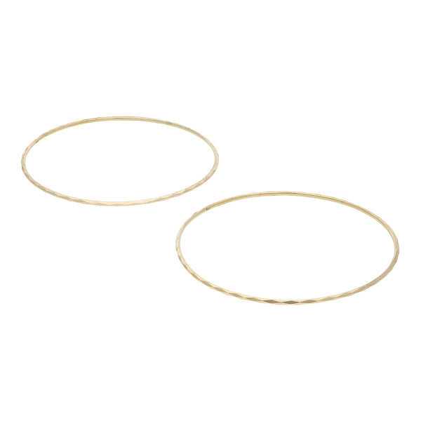 Dos pulseras de arillo facetadas en oro amarillo 14 kilates.