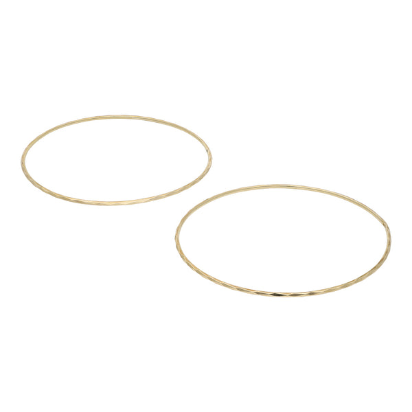Dos pulseras de arillo facetadas en oro amarillo 14 kilates.