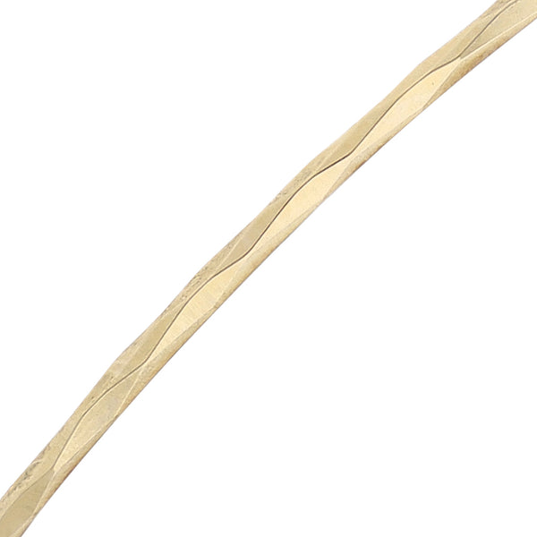 Dos pulseras de arillo facetadas en oro amarillo 14 kilates.