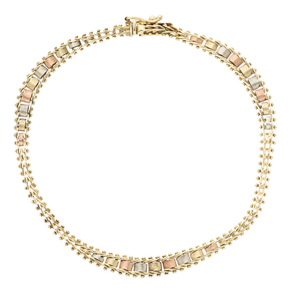Pulsera eslabón boleado en oro tres tonos 14 kilates.