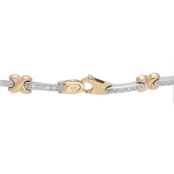 Pulsera eslabón articulado con circonias en oro dos tonos 14 kilates.