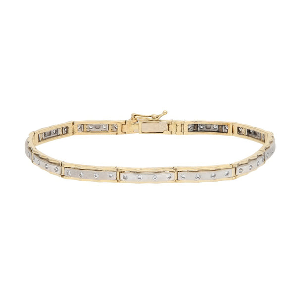 Pulsera eslabón articulado con circonias en oro dos tonos 14 kilates.