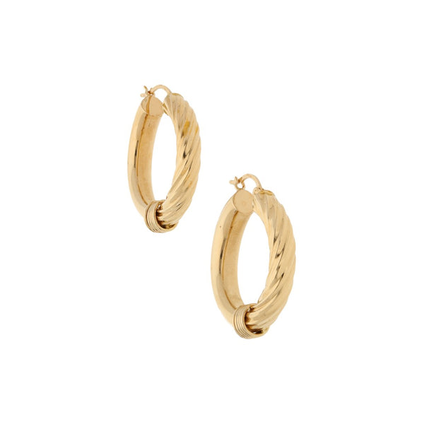 Arracadas huecas en oro amarillo 14 kilates.