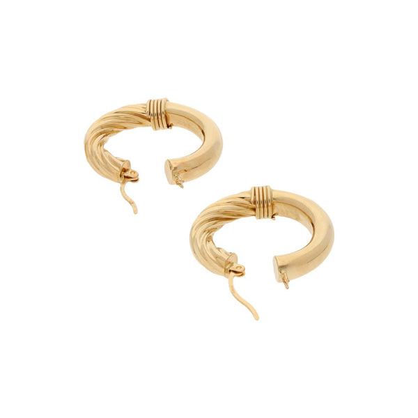 Arracadas huecas en oro amarillo 14 kilates.