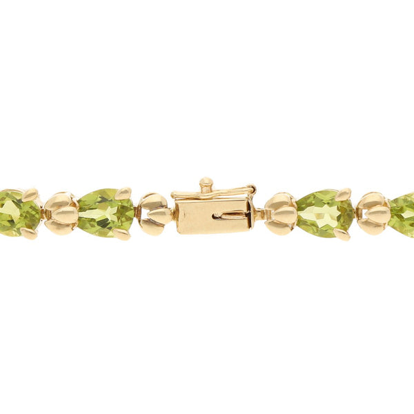 Pulsera eslabón articulado con sintéticos en oro 14 kilates.