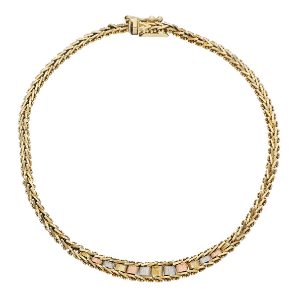 Pulsera eslabón boleado en oro tres tonos 14 kilates.
