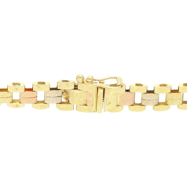 Pulsera eslabón articulado en oro tres tonos 14 kilates.