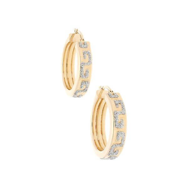 Arracadas huecas con diamantina en oro amarillo 14 kilates.