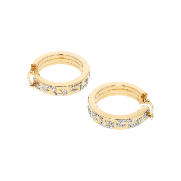 Arracadas huecas con diamantina en oro amarillo 14 kilates.