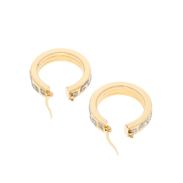 Arracadas huecas con diamantina en oro amarillo 14 kilates.