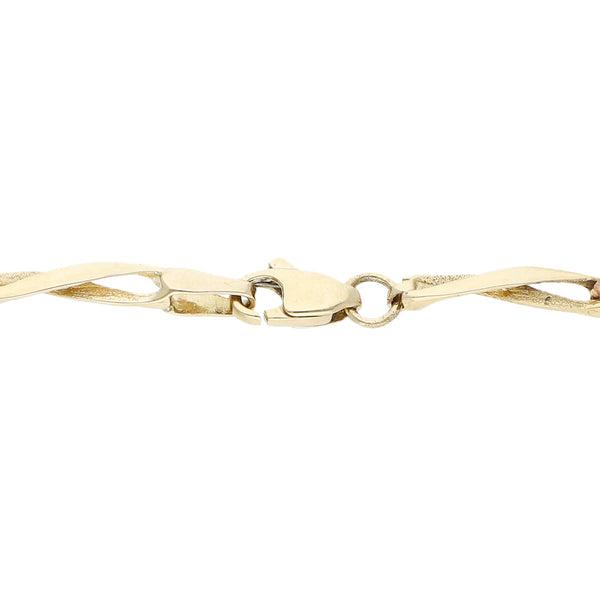 Pulsera eslabón articulado motivo flores en oro tres tonos 14 kilates.
