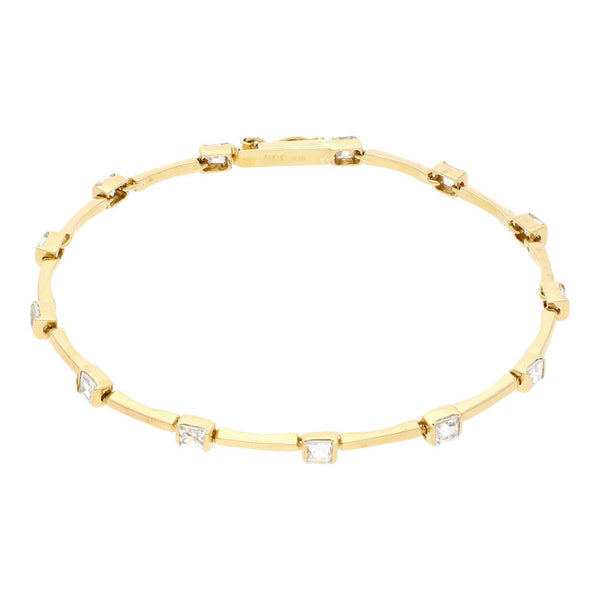 Pulsera eslabón articulado con aplicaciones de circonias en oro amarillo 14 kilates.