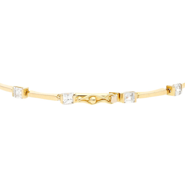 Pulsera eslabón articulado con aplicaciones de circonias en oro amarillo 14 kilates.