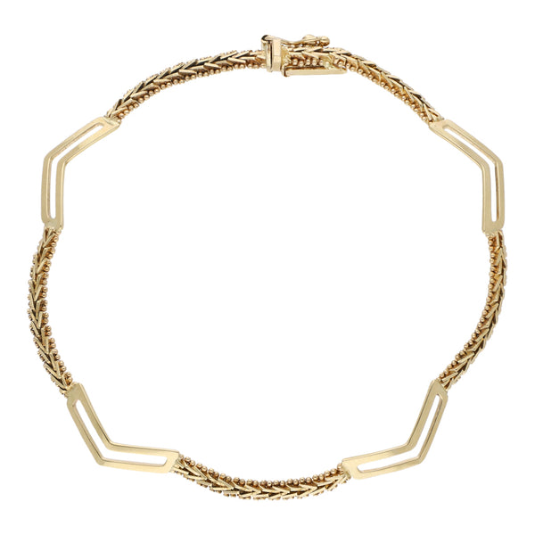 Pulsera eslabón combinado en oro amarillo 14 kilates.
