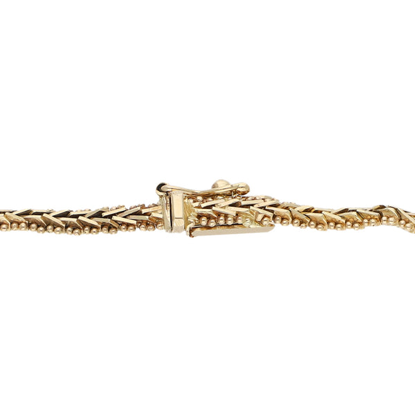 Pulsera eslabón combinado en oro amarillo 14 kilates.
