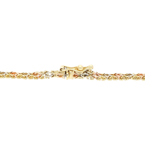 Pulsera eslabón boleado en oro tres tonos 14 kilates.