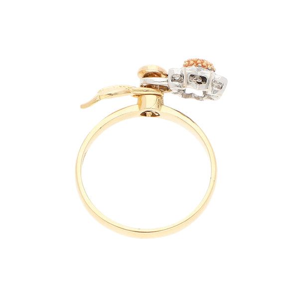 Anillo giratorio motivo girasol con circonias en oro dos tonos 14 kilates.