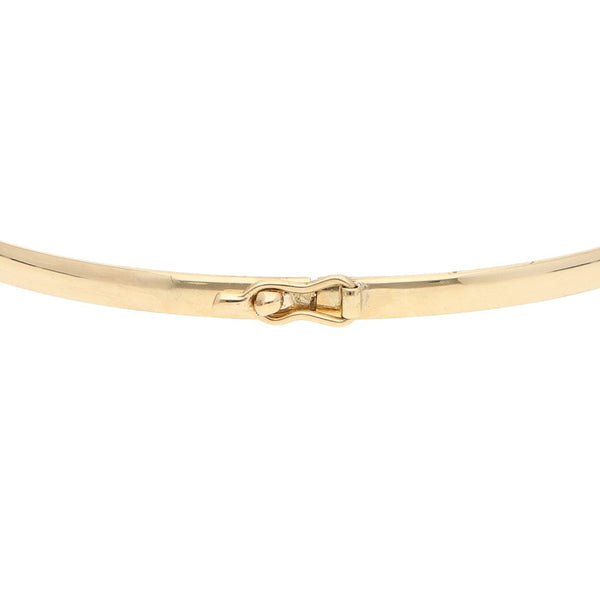 Pulsera de arillo lisa en oro amarillo 14 kilates.