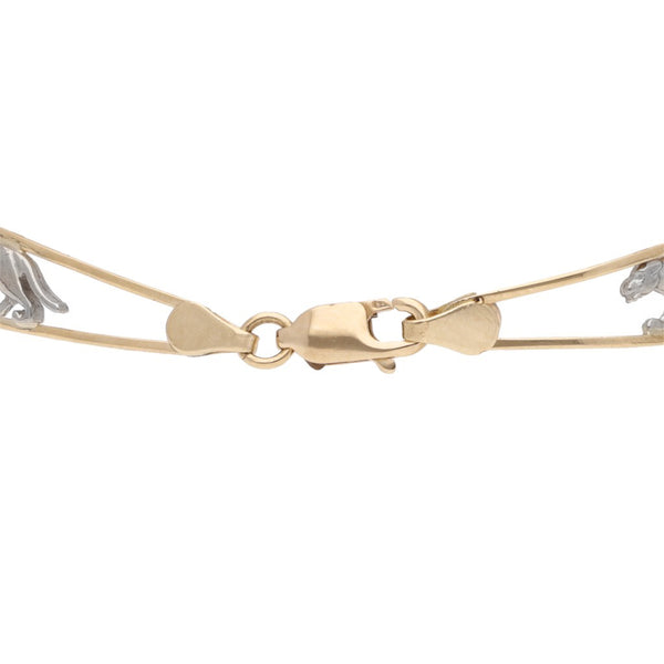 Pulsera eslabón encontrado con aplicaciones motivo pantera en oro dos tonos 14 kilates.