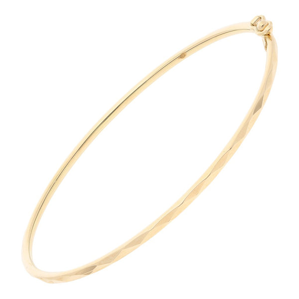 Pulsera de arillo facetada en oro amarillo 14 kilates.