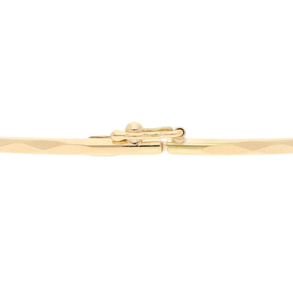 Pulsera de arillo facetada en oro amarillo 14 kilates.