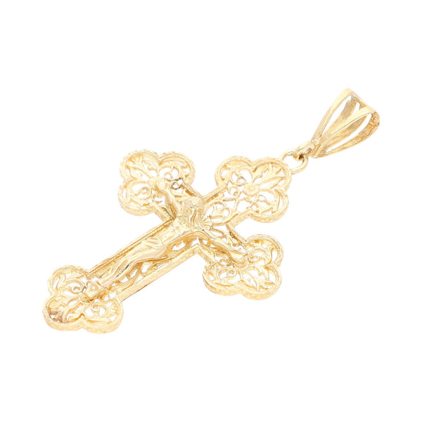 Crucifijo calado en oro amarillo 14 kilates.