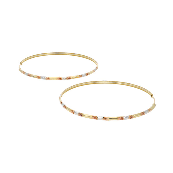 Arracadas labradas en oro amarillo 14 kilates.