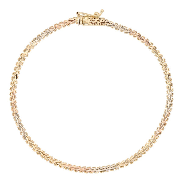 Pulsera eslabón boleado en oro tres tonos 14 kilates.