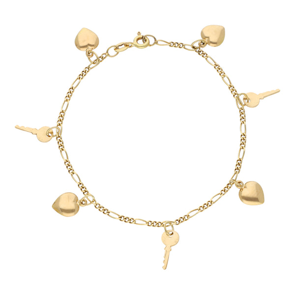 Pulsera de tres eslabones por uno con colgantes motivo corazón y llave en oro amarillo 18 kilates.