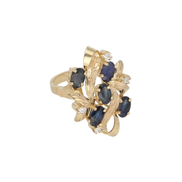 Anillo diseño especial con zafiros y circonias en oro amarillo 14 kilates.