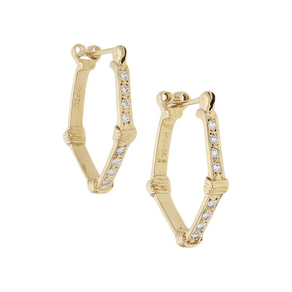 Arracadas diseño especial con circonias en oro amarillo 14 kilates.