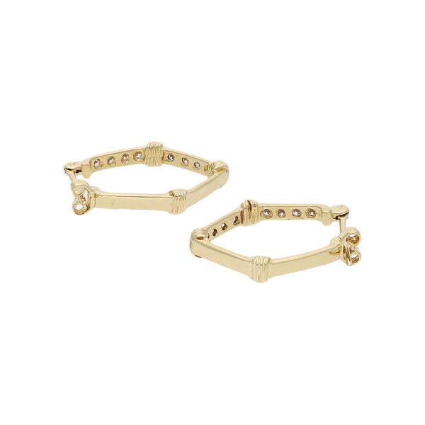 Arracadas diseño especial con circonias en oro amarillo 14 kilates.