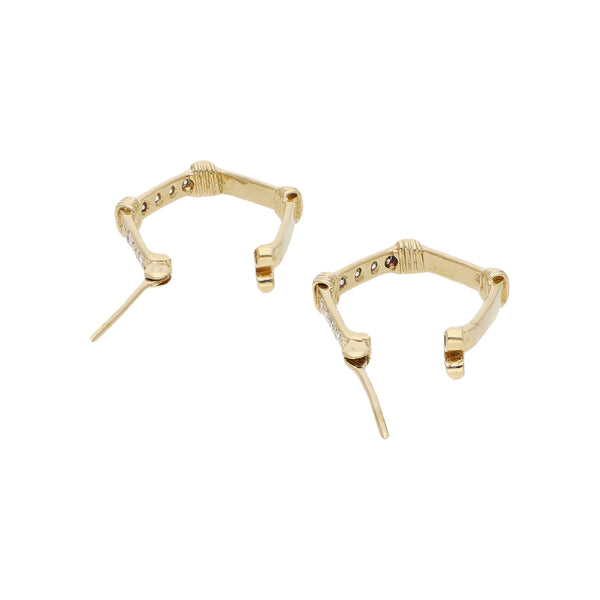 Arracadas diseño especial con circonias en oro amarillo 14 kilates.