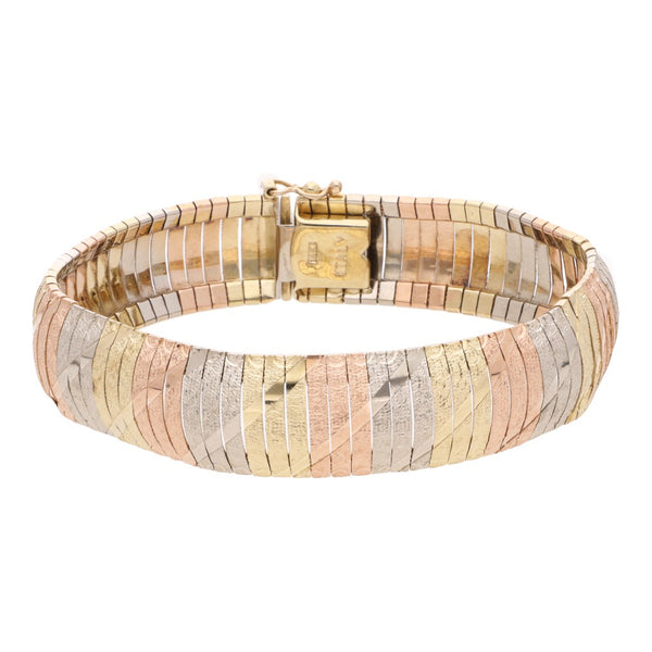Pulsera eslabón articulado en oro tres tonos 14 kilates.
