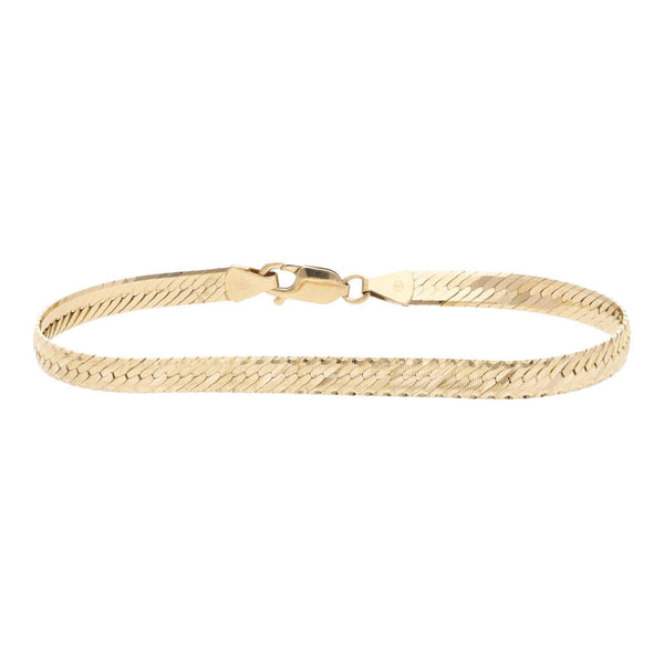 Pulsera eslabón planchado en oro amarillo 14 kilates.